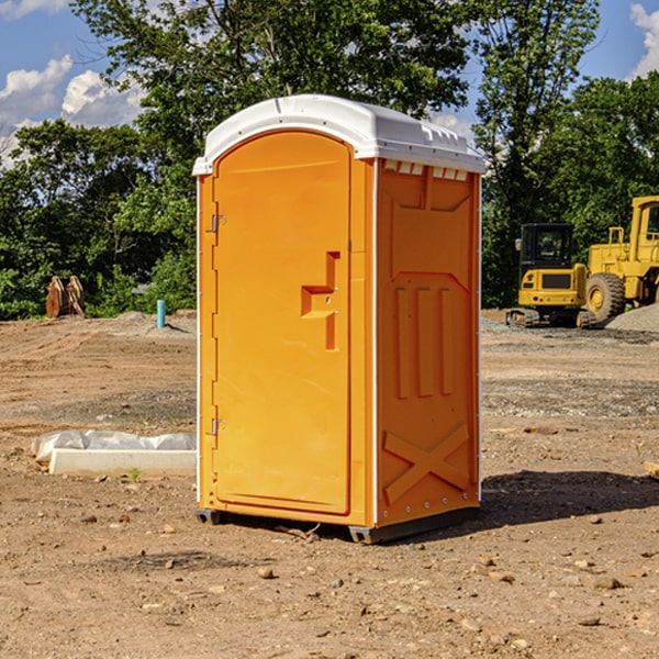 what is the cost difference between standard and deluxe portable restroom rentals in Aurora IA